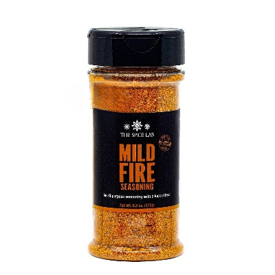 Spice jar labeled 'Mild Fire Seasoning' by The Spice Lab on a white background